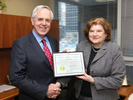 Standards Council of Canada’s (SCC’s) CEO, John Walter, presents ASTM’s Canadian office director, Diane Thompson, with the certificate of accreditation.