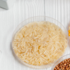 Food in trays beside testing tubes and microscope